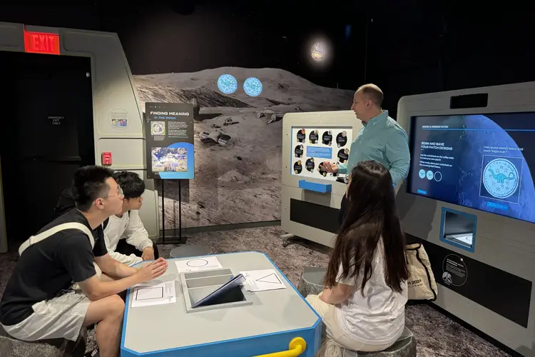 Fall 2024’s MoonRover team in discussion with Moonshot Museum’s Mike Hennessy.