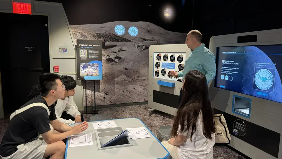 Fall 2024’s MoonRover team in discussion with Moonshot Museum’s Mike Hennessy.