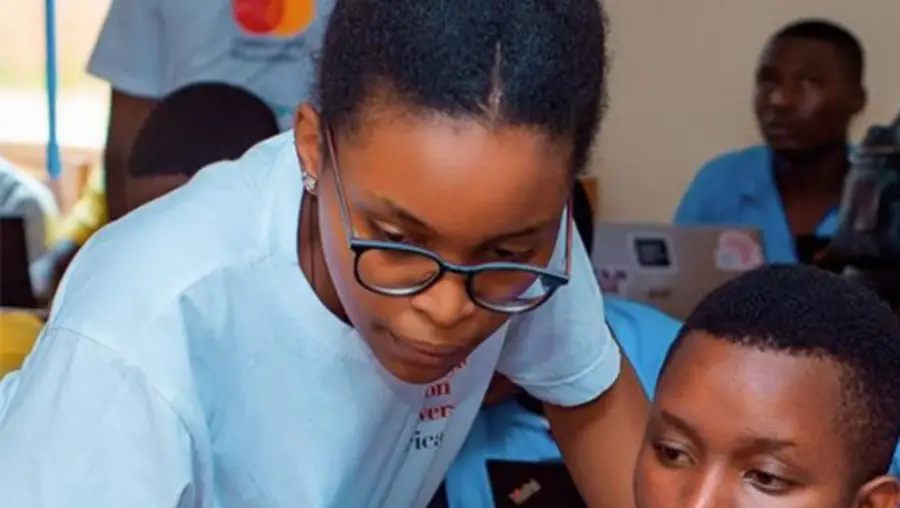 Clemence Ingabire teaching a young student