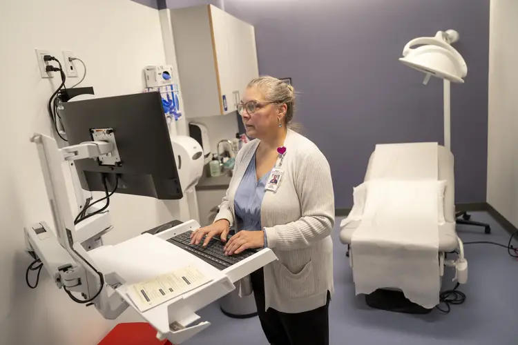 Dr. Andrews working in exam room