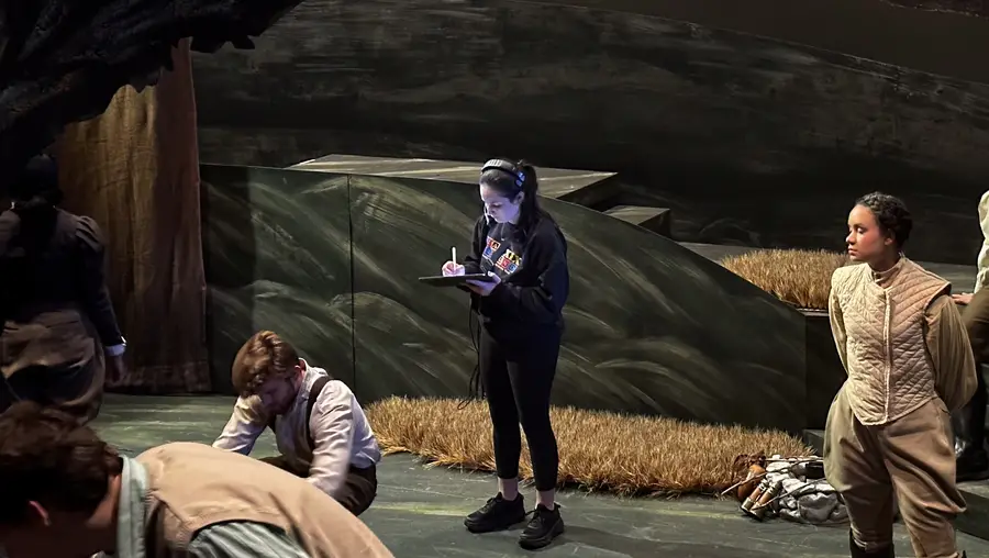 Liberty Lapayowker (center) acting as assistant stage manager for a production of “You on the Moors Now” during her sophomore year.